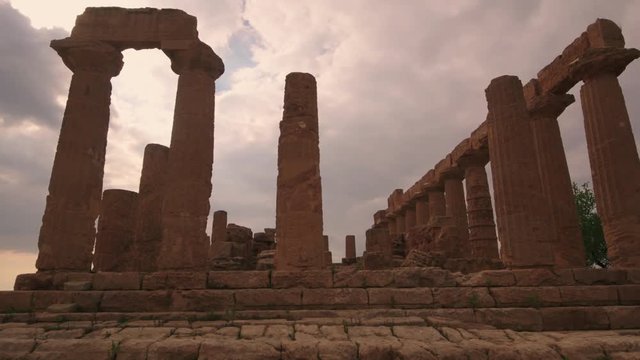 Panning view of Greek temple of Juno in the valley of temples in Sicily before sunset