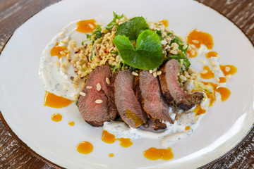 Lamb tenderloin served with barley salad