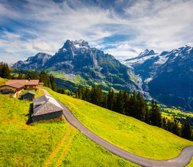 Colorful morning view of Grindelwald village valley from cableway. Wellhorn mountain, Bernese...