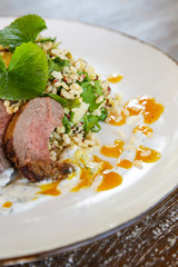 Lamb tenderloin served with barley salad