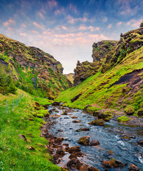 Typical volcano Icelandic landscape in the mountains. Sunny summer sunrise of green canyon with...