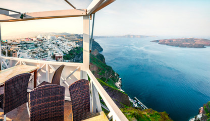Sunny morning view of Santorini island. Picturesque spring scene of the  famous Greek resort Fira, Greece, Europe. Traveling concept background.