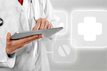 Close-up Doctor at hospital working with tablet pc