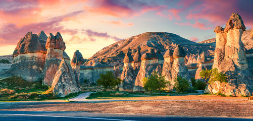 Impressive fungous forms of sandstone in the canyon near Cavusin village, Cappadocia, Nevsehir Province in the Central Anatolia Region of Turkey, Asia. Beauty of nature concept background. - obrazy, fototapety, plakaty