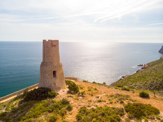Torre del Gerro tower. Ancient 16th century watchtower on the top of a cliff in Denia, Spain
