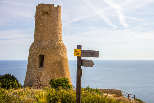 Torre del Gerro tower. Ancient 16th century watchtower on the top of a cliff in Denia, Spain