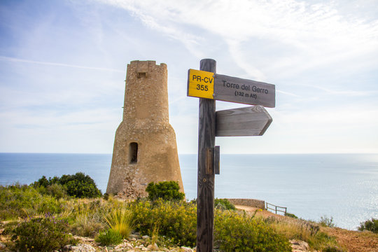 Torre del Gerro tower. Ancient 16th century watchtower on the top of a cliff in Denia, Spain