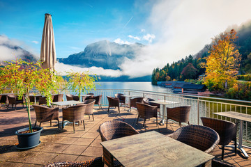 Sunny autumn scene of Altausseer See lake. Great morning from coze resting place in Altaussee village, district of Liezen in Styria, Austria. Beauty of countryside concept background.
