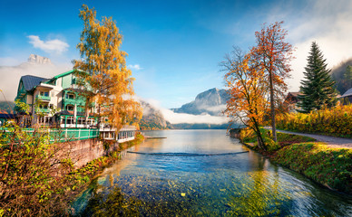 Colorful autumn scene of Altausseer See lake. Sunny morning view of Altaussee village, district of...