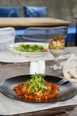 Healthy organic vegetarian dishes served on the restaurant table, casual dining restaurant food	