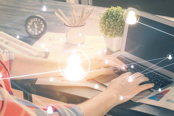 Media network theme hologram with man working on computer on background. Concept of internet...