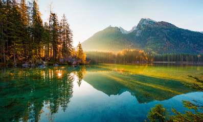 Wonderful autumn sunrise of Hintersee lake. Amazing morning view of Bavarian Alps on the Austrian...