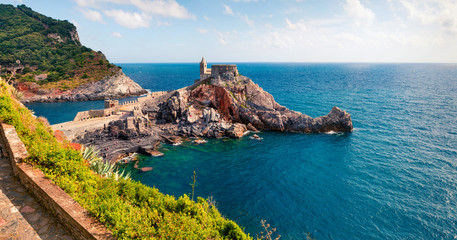 Sunny morning view of Saint Peter Church in Portovenere town. Picturesque spring seascape of...