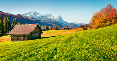 Splendid morning scene of Garmisch-Partenkirchen village with Zugspitze mountain range on...