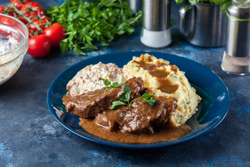 Stewed pork neck with potatoes and sauce