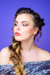 Braided hairstyle. Girl makeup face braided long hair. French braid. Professional hair care and creating hairstyle. Beauty salon hairdresser art. Beautiful young woman with modern hairstyle
