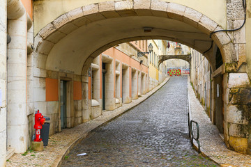Passage in narrow street in Lisbon, Portugal