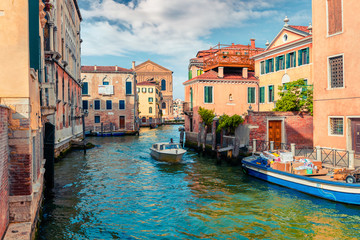 Bright spring view of Vennice with famous water canal and colorful houses. Splendid morning scene in Italy, Europe. Magnificent Mediterranean cityscape. Traveling concept background.