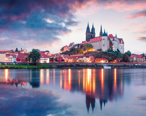 Dramatic autumn sunset view of oldest overlooking the River Elbe castle - Albrechtsburg. Colorful veneig cityscape of Meissen, Saxony, Germany, Europe. Traveling concept background.