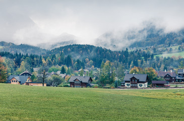 Foggy autumn view of Brauhof village. Amazing morning scene of  Austrian Alps, Styria stare of Austria, Europe. Beauty of countryside concept background. Instagram filter toned.