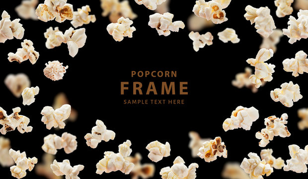 Popcorn frame, flying popcorn isolated on black background with copy space, movie poster concept