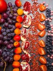 Various red fruits, berries rich in vitamin, resveratrol, antioxidants Top view