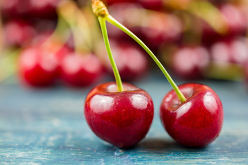 Sweet cherries on wooden table.