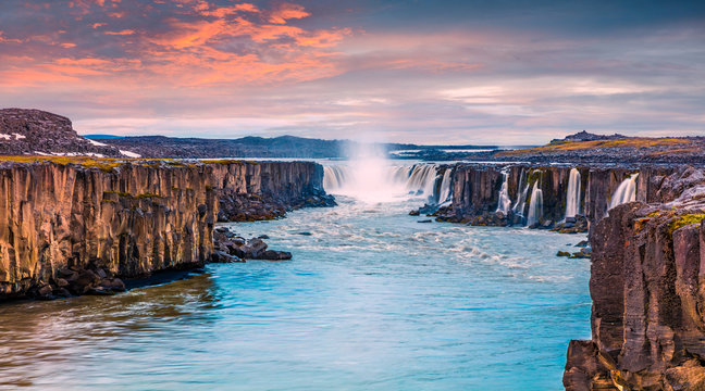 Colorful summer landscape on Jokulsa a Fjollum river. Beautiful sunrise scene on the Selfoss Waterfall in Jokulsargljufur National Park, Iceland, Europe. Beauty of nature concept background.