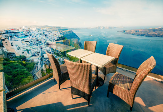 Sunny morning view of Santorini island. Bright spring scene of the  famous Greek resort Fira, Greece, Europe. Traveling concept background. Instagram filter toned.