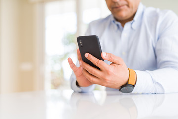 Close up of business man hands using smarpthone