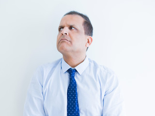 Middle age man thinking clueless about a question