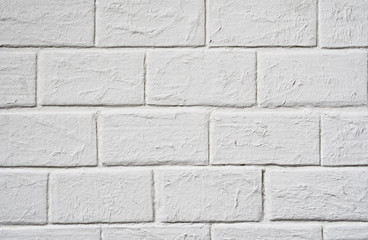 Textural background: white brick wall close up