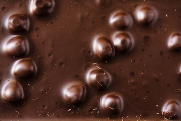 Chocolate bar with nuts background