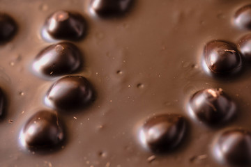 Chocolate bar with nuts background