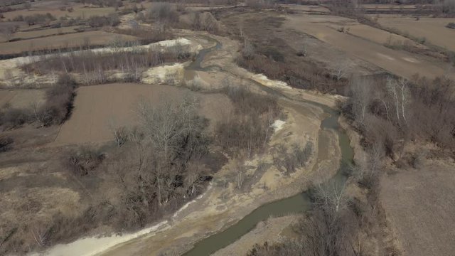 River coast polluted from mine drainage 4K aerial footage
