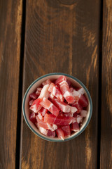 bacon cubes on wooden surface