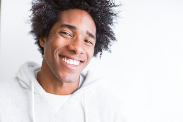 African American man over white isolated background with a happy and cool smile on face. Lucky person.