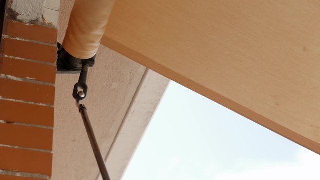 unfolding the awning