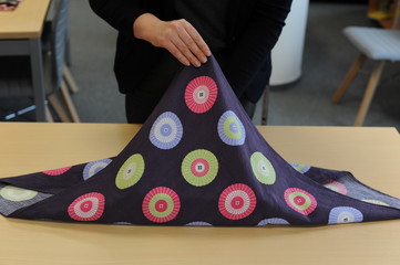 Furoshiki traditional Japanese ecological gift wrapping cloth and technique demonstration