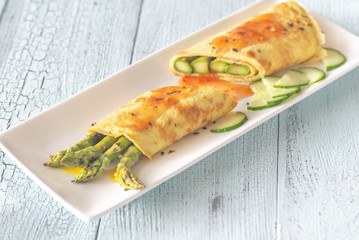 Coconut crepes with grilled asparagus