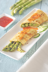Coconut crepes with grilled asparagus