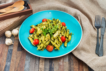 close-up of plate of pasta and chicken with lettuce