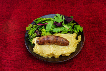 Mashed potato with cream, butter and emmental, grilled sausage