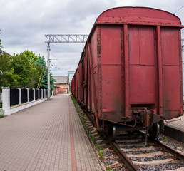 Fototapeta premium Cargo wagon in the train station.