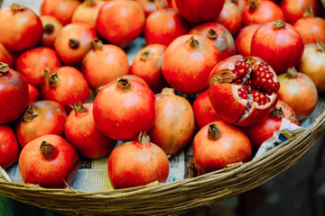 Fototapeta na wymiar a basket full of pomegranates standing on Goa market