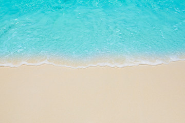 Fototapeta Soft waves of blue sea on the Maldives beach for the background. obraz