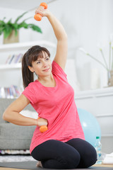 Fototapeta na wymiar woman exercising at home