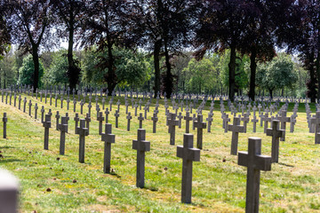 Fototapeta na wymiar A lot of small, concrete crosses at the German war cemetery in the Netherlands.