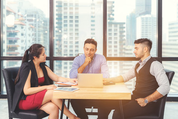 Businesspeople discussing together in conference room during meeting at office.