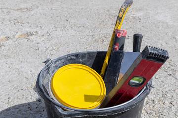 Image of construction tools in a bucket © AleksViking